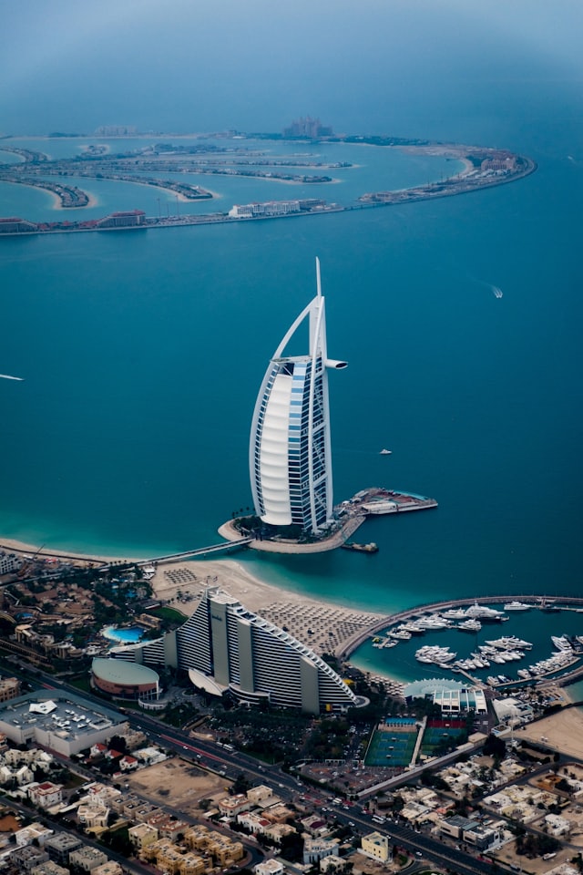 An aerial view of a coastal city and marina