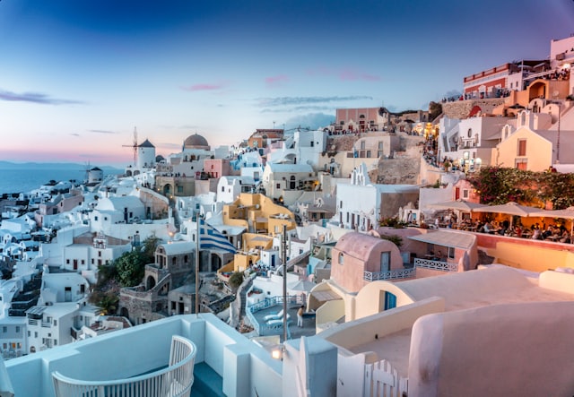 A whitewashed island town at dusk